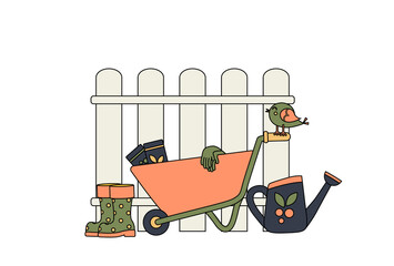 Garden wheelbarrow next to the fence and garden accessories. Concept. Garden supplies. Watering can next to the wheelbarrow and rubber boots. Gardening gloves for planting seeds. Colorful and Cartoon.