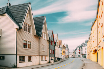Alesund, Norway. Old Wooden Houses In Cloudy Summer Day