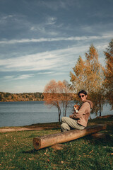 beautiful girl with short hair is walking on a warm autumn day with her pet beagle puppy