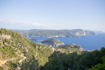 Fototapeta premium Top view of hilly mountains and sea