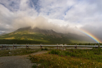 Rainbow over Alaska pipeline after rain
