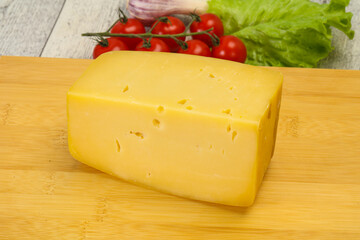 Hard yellow tasty cheese brick