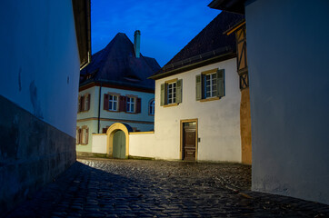 Narrow historical alley in the old town of Bamberg at night, World Heritage Site City of Bamberg, Germany