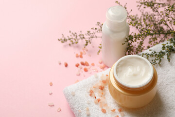 Fototapeta na wymiar Concept of spa cosmetics on pink table