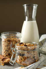 Concept of tasty breakfast with granola on gray background