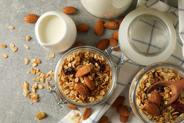 Concept of tasty breakfast with granola on gray background