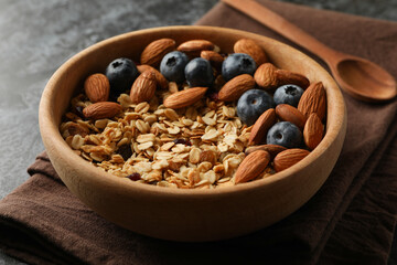Napkin with bowl of granola on black smokey table