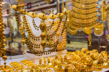 Golden jewelry at the gold street, also called Gold souk, in the city of Dubai, UAE
