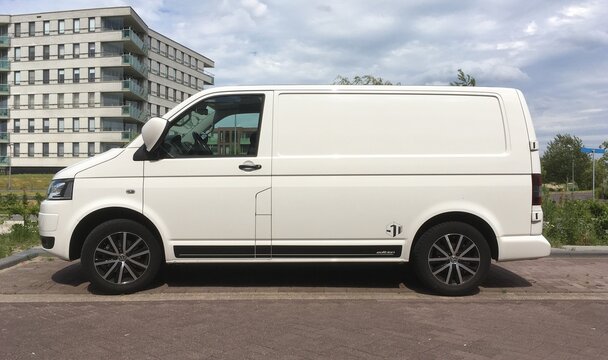 Almere, the Netherlands - June 11, 2017: White Transporter sport parked on a public parking lot in the city of Almere. Nobody in the vehicle.