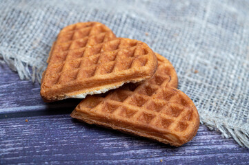 Delicious homemade cookies on the background of rough homespun fabric. Close-up, selective focus.