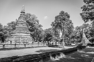 Landmark of old chedi made of ancient bricks in the Kamphaeng Phet Historical Park, Thailand. Black and white