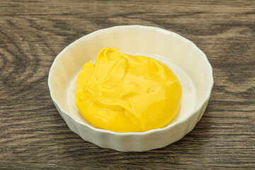 Natural cheese sauce in the bowl