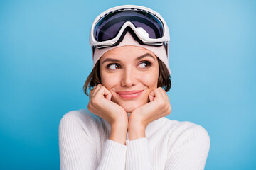 Photo of inspired dreamy woman look empty space imagine winter weekend in mountains isolated on blue color background