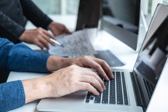 Team of Professional Developer programmer cooperation meeting and brainstorming and programming in website working a software and coding technology, writing codes and database
