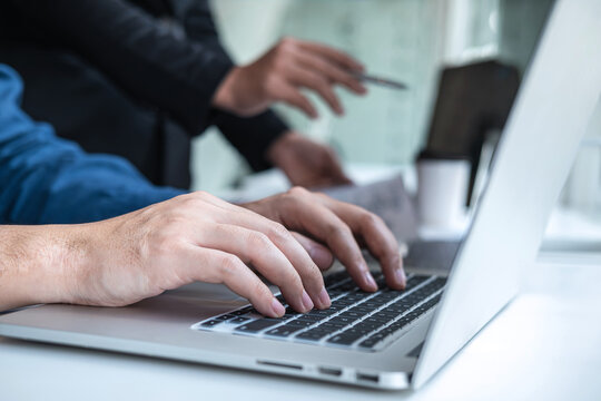 Professional Developer programmer cooperation meeting and brainstorming and programming in website working a software outsourcing and coding technology, writing codes and database