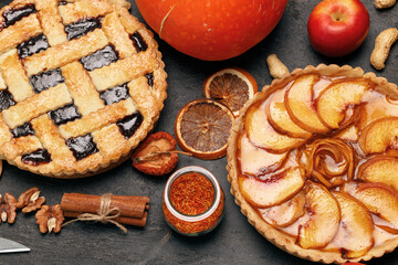 Berry tart pie and apple tart pie on black background