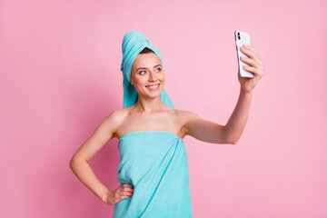 Photo of charming confident girl using telephone to take selfie isolated over pastel color background