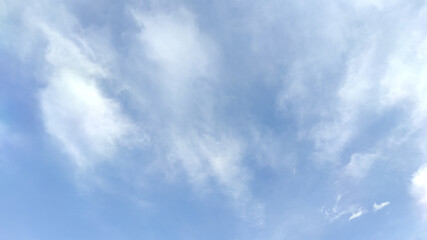 Obraz premium White Fluffy Clouds with Blue Sky Background.