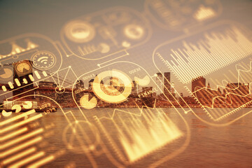 Double exposure of technology theme hologram and cityscape background. Concept of Hightech.