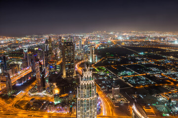 Night aerial view of Dubai from the top of  Burj Khalifa Tower in Dubai, United Arab Emirates, the tallest building in the world.