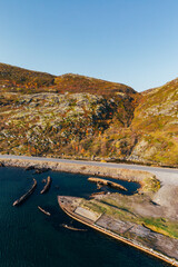 Cemetery of old ships in Teriberka Murmansk Russia, dramatic photo. Aerial top view.