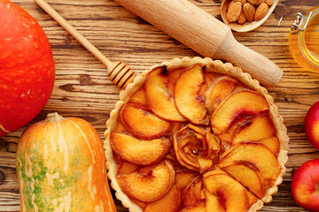 Top view of apple pie on wooden board