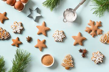 Christmas gingerbread cookies in blue background. Flat lay style.