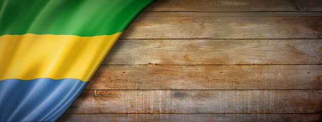 Gabonese flag on vintage wood wall banner