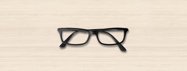 Black glasses isolated on white wooden banner