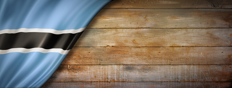 Botswana flag on vintage wood wall banner