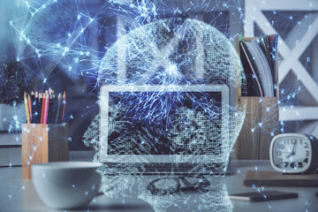 Double exposure of work space with computer and human brain drawing hologram. Brainstorm concept.