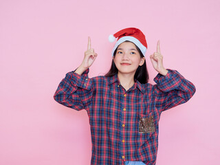 Teenage girl wearing Santa Claus hat