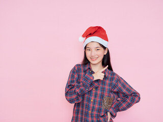 Teenage girl wearing Santa Claus hat