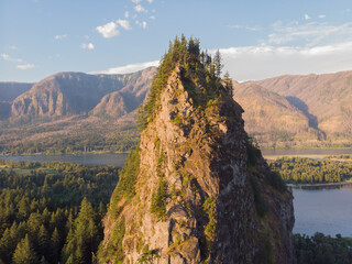 Aerial close-up view of the amazing forest mountains with rocks landscape at sunny day. Clean...