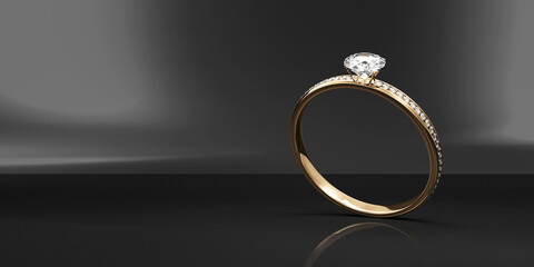 Gold Wedding Ring with Diamonds on black studio background
