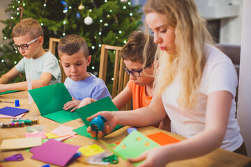 Preschool kids trying to concentrate on the teacher's task