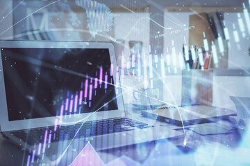 Forex Chart hologram on table with computer background. Double exposure. Concept of financial markets.
