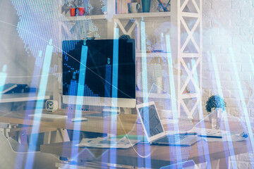 Financial chart drawing and table with computer on background. Multi exposure. Concept of...
