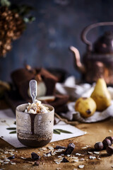 Hot chocolate with whipped cream and toasted almonds in a ceramic glass