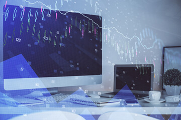 Financial graph colorful drawing and table with computer on background. Multi exposure. Concept of...