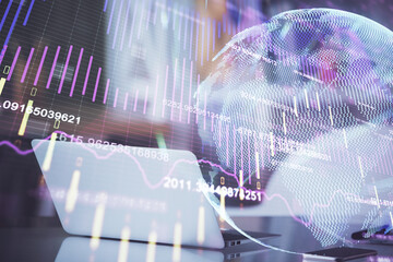 Financial graph colorful drawing and table with computer on background. Double exposure. Concept of...