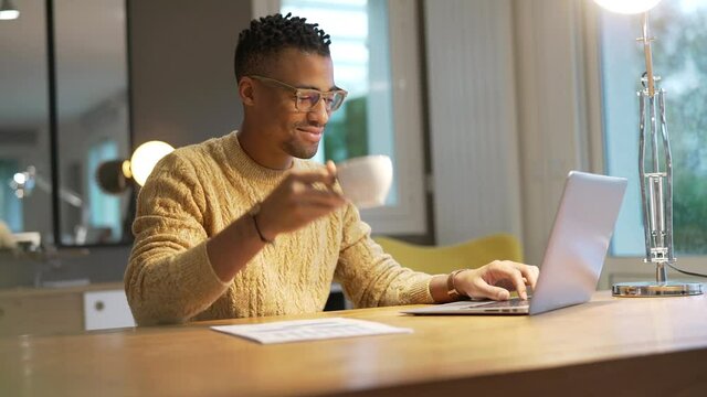 Portrait of african american trendy guy in a distant online call