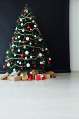 New Year's decor holiday Christmas interior of the Christmas tree pine tree gifts