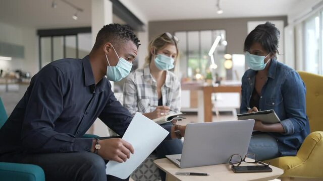 Business People Meeting With Face Masks In The Office