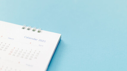 Fototapeta premium 2021 calendar page on blue background business planning appointment meeting concept