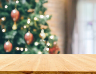 Empty table top with blurred Christmas tree with bokeh light background