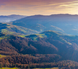 Obraz premium Silhouette of mountains in the early foggy morning. Mountain view in autumn. Beautiful natural landscape. View from above. Carpathian mountains. Ukraine