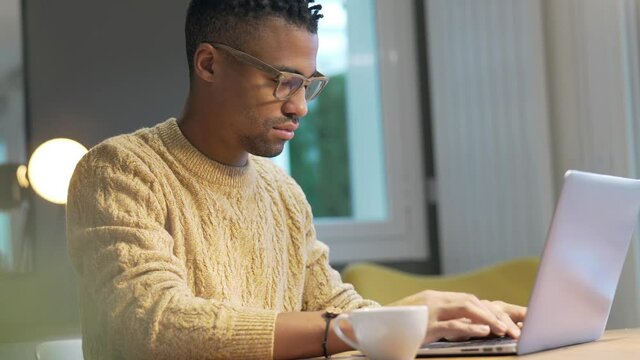 Portrait of african american trendy guy in a distant online call