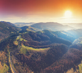 Obraz premium Silhouette of mountains in the early foggy morning. Mountain view in autumn. Beautiful natural landscape. View from above. Carpathian mountains. Ukraine