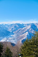 Winter landscape high in the mountains with blue sky 